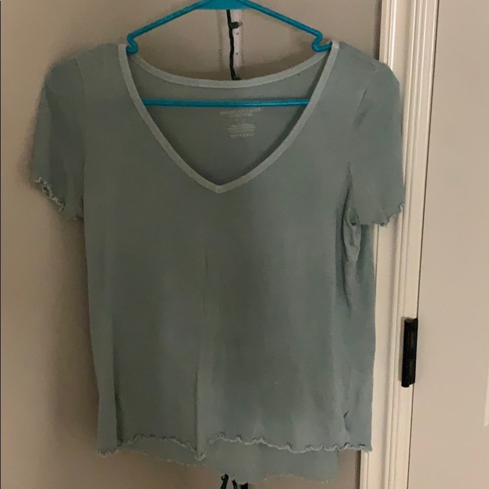 green v neck shirt